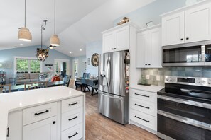 Fridge, coffee/tea maker, blender, cookware/dishes/utensils