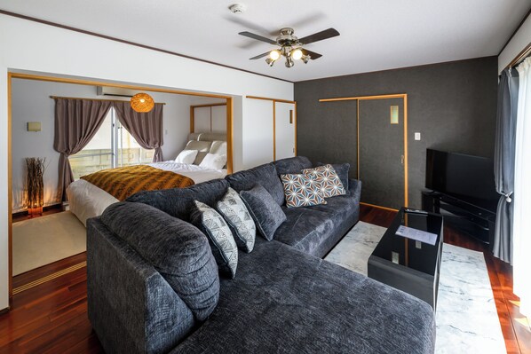 Apartment | Living area | Flat-screen TV - Ocean View Terrace BISE 1F (Motobu)