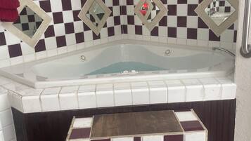 Jetted tub, hair dryer, towels, soap