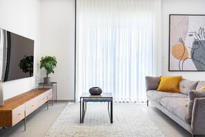 Apartment, Balcony | Living area | 65-inch Smart TV with digital channels - Modern Haven in South TLV by Sea N' Rent (Tel Aviv)