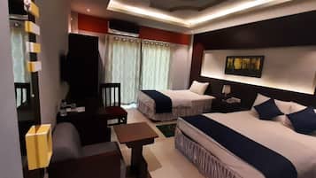 Deluxe Triple Room, Lake View | Living area | 48-inch Smart TV with cable channels