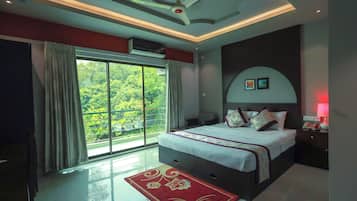 Deluxe Double Room, Lake View | Living area | 48-inch Smart TV with cable channels