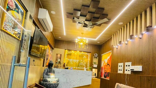 A modern interior with a reception desk, seating area, and decorative elements. - Shree Keshav Haweli (Sikar)