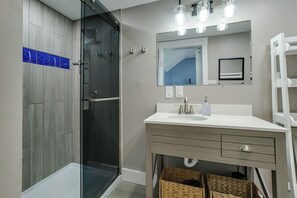 Shower, hair dryer, towels, toilet paper