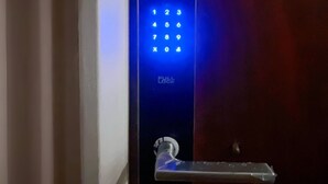 A blue electronic keypad lock on a door. - Cozy Studio in Palermo with Private Patio! (Buenos Aires)