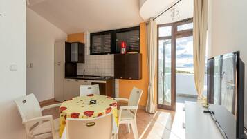 Apartment (One Bedroom Apartment with Terrace an) | Living room | 32-inch flat-screen TV with cable channels