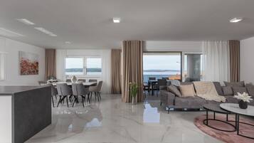 Family Apartment, Multiple Bedrooms, Sea Facing (Pool Apartment Sunset With Sea View) | Living area | 21-inch flat-screen TV with digital channels, TV