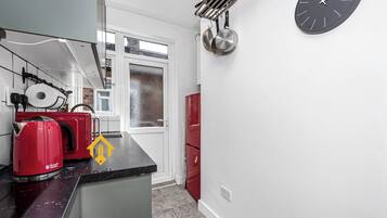 Microwave, oven, dishwasher, dining tables