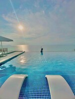 5 outdoor pools, open 6:00 AM to 8:00 PM, pool umbrellas, pool loungers