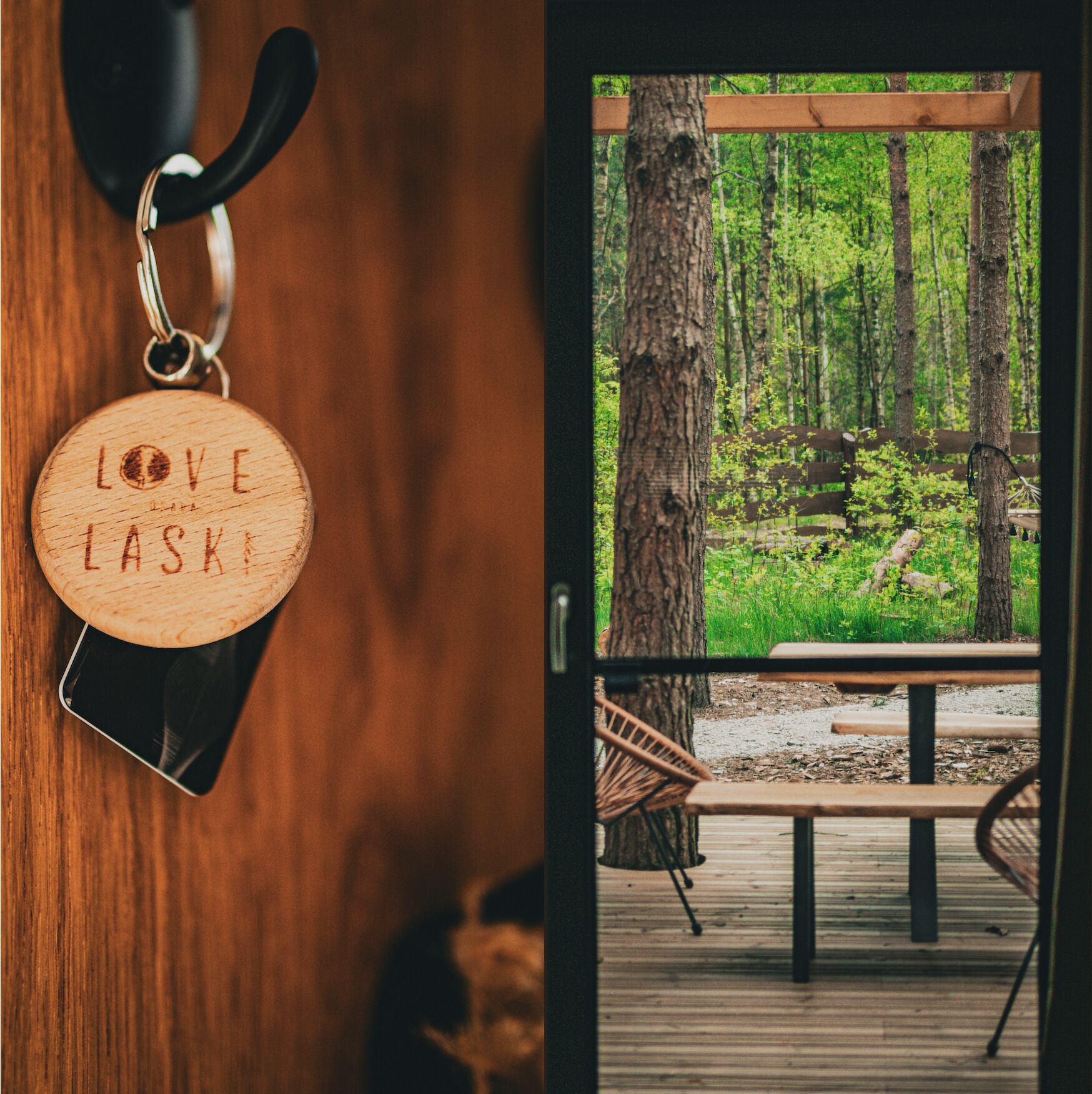 A wooden keychain with the inscription "LOVE LASKEI" and a view of a forested area with a wooden deck and chairs.