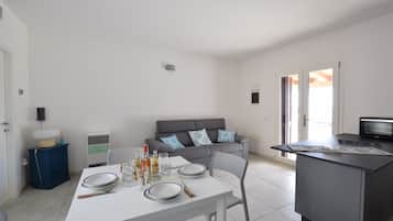 Villa, Sea View | Living area | 32-inch flat-screen TV with cable channels