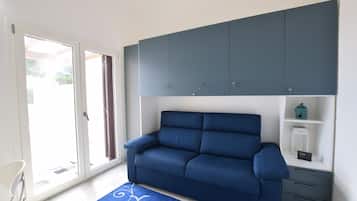 Villa, Sea View | Living area | 32-inch flat-screen TV with cable channels