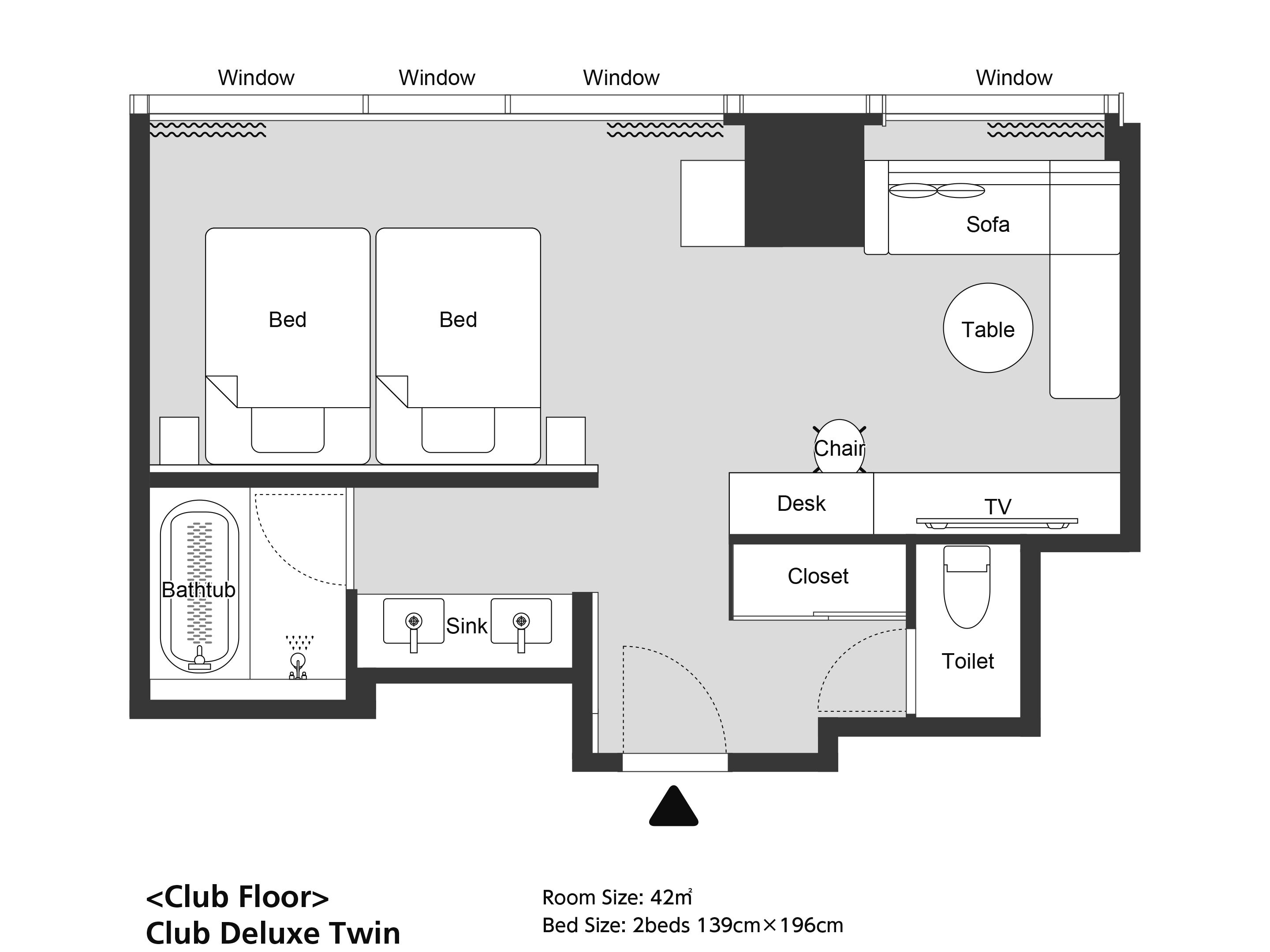 A Club Deluxe Twin room layout with two beds, a sofa, a table, a desk, a TV, a closet, a toilet, and a bathtub.