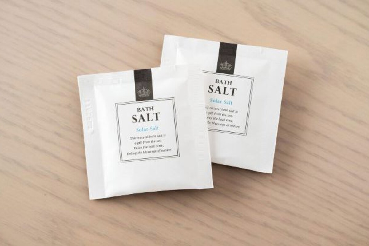 Two white bags labeled 'Bath Salt' with a black ribbon.