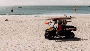 A lifeguard vehicle on a sandy beach with the ocean in the background. - 'Key Point' - Tranquil Getaway - Mooloolaba (Mooloolaba)