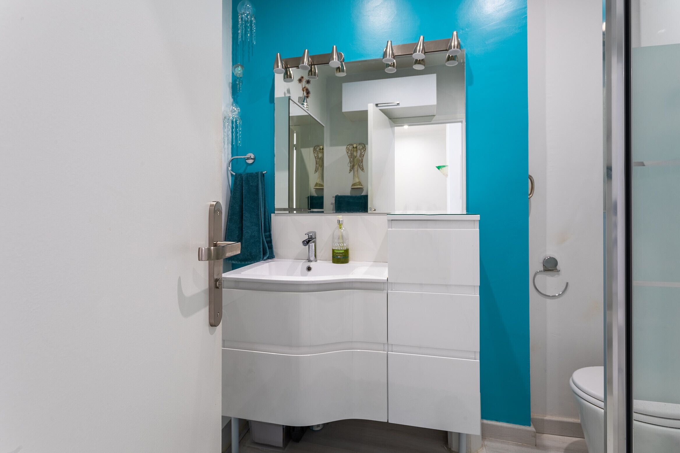 Shower, hair dryer, towels, toilet paper