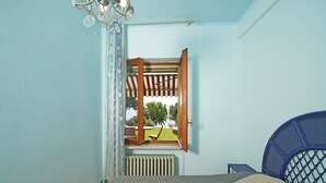 A bedroom with a bed, a window with an open wooden shutter, a radiator, and a ceiling light fixture. - Il Melagrano A6 by Wonderful Italy (Padenghe sul Garda)