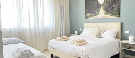 Deluxe Quadruple Room, Balcony | Premium bedding, down comforters, in-room safe, individually decorated