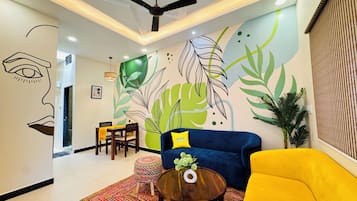 Deluxe House | Living area | Flat-screen TV