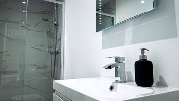 Shower, towels, soap, shampoo