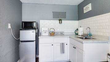 Microwave, coffee/tea maker, cookware/dishes/utensils, paper towels