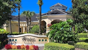 A building with a sign reading "Windsor." - Summer Dreams 3 Bed Condo In Windsor Hills 3 Bedroom Condo by RedAwning (Kissimmee)
