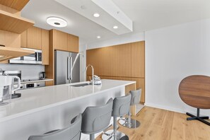 Condo, 2 Bedrooms | Private kitchen | Fridge, oven, coffee/tea maker