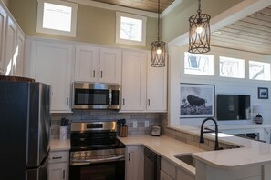 Fridge, microwave, oven, dishwasher - Bison River Hideaway- Tiny Luxury Living with River Views (Bryson City)