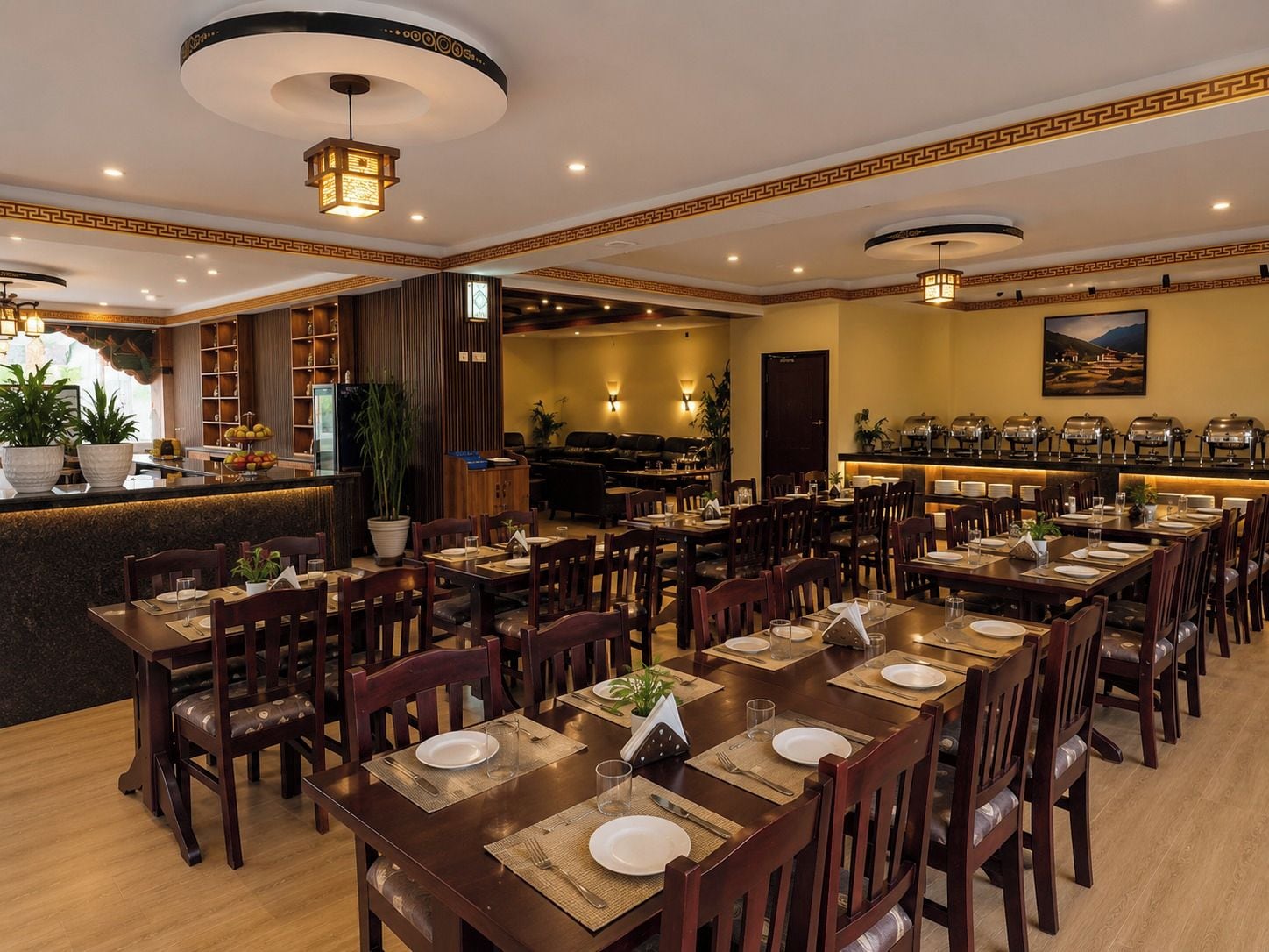 A restaurant with multiple dining tables, chairs, and a bar area.