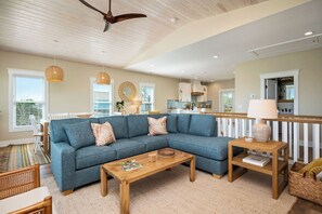 TV, fireplace, books - All Sands On Deck: Custom-Built Home With Artistic Coastal Decor (Oak Island)