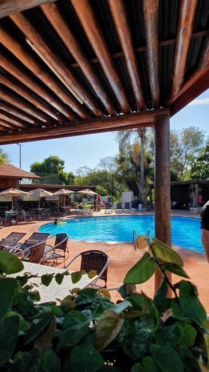 Indoor pool, 2 outdoor pools, open 10:00 AM to 10:00 PM, pool umbrellas