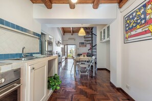 Apartment, Balcony, City View | Private kitchen | Coffee/tea maker, electric kettle, dining tables