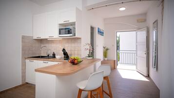 Classic Studio, Balcony, Beachfront | Private kitchen | Mini-fridge, high chair, cookware/dishes/utensils