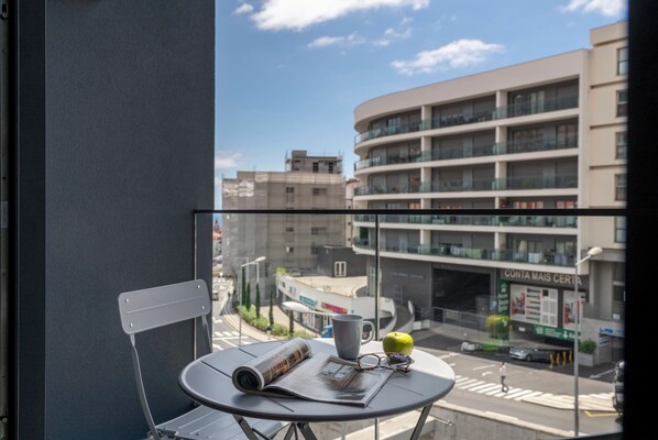 Relax on the balcony with a view of the city.