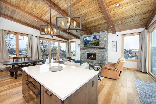 TV, fireplace, books, stereo - Luxurious Downtown Penthouse w/ Hot Tub! (Whitefish)