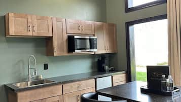 Microwave, coffee/tea maker, cookware/dishes/utensils, kitchen islands