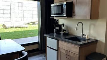 Microwave, coffee/tea maker, cookware/dishes/utensils, kitchen islands