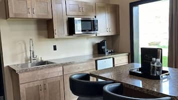 Microwave, coffee/tea maker, cookware/dishes/utensils, kitchen islands