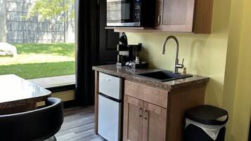 Microwave, coffee/tea maker, cookware/dishes/utensils, kitchen islands