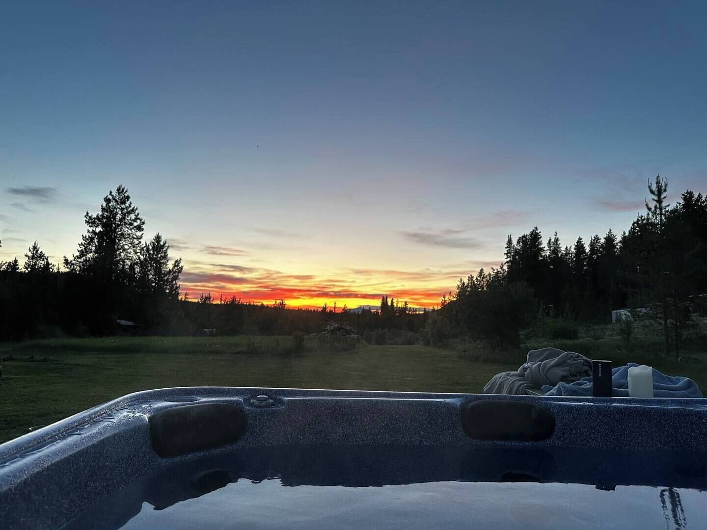 Outdoor spa tub. Luxurious private Atlin retreat w/hot tub under the stars, BBQ and fire pit!!