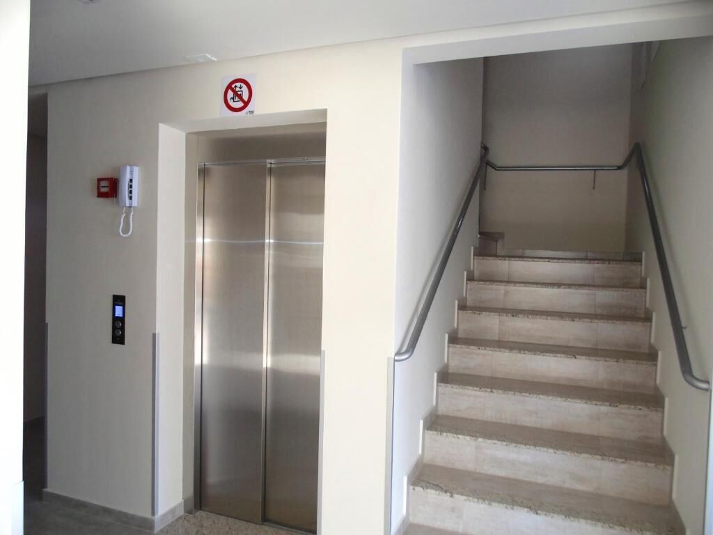 An elevator and a staircase in a building.