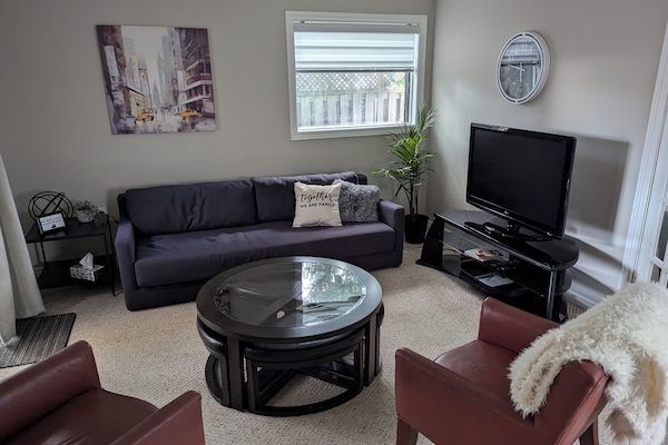 Living room with big screen TV includes Netflix and unlimited Internet.
