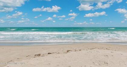 Affordable ONE BR Main Floor Condo RIGHT ON THE BEACH w/ KING Bed & Heated POOL!
