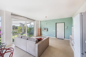 Apartment | Living area | 35-cm TV with digital channels - La Bouganville P1-1 Apartment (Toscolano Maderno)