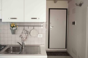 Apartamento | Cozinha privada | Geladeira, fogão, cooktop, lava-louças