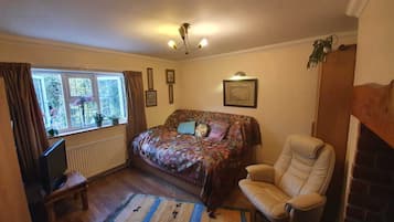 1 bedroom, desk, iron/ironing board, travel crib