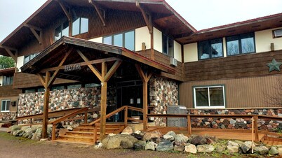 Private family style, corner room in our Lodge at North Ironwood Acres resort offering a sunrise view. 3 beds. 2 bathrooms. DOG FRIENDLY!