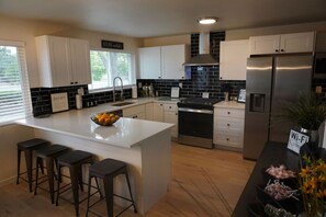 Fridge, microwave, oven, stovetop - Spacious Ranch w/Hot Tub & Game Room, Sleeps 14! (Greeley)