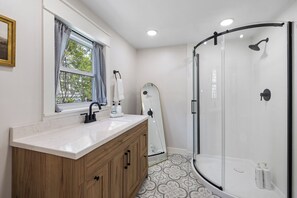 Shower, hair dryer, towels, soap