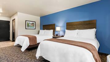 Premium bedding, pillow-top beds, desk, laptop workspace